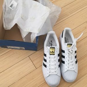Brand new, never worn Men’s Adidas Superstars!
